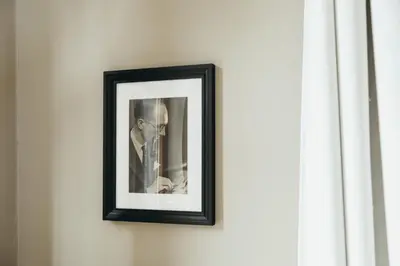 a picture of a man hanging on a wall at Au pied du Pré by WelcHome in Verviers