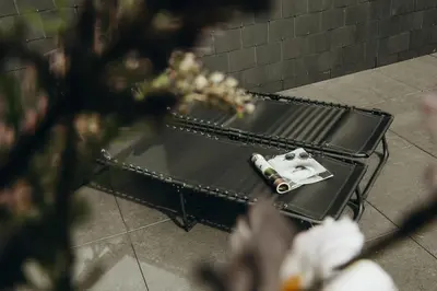 a bench with a camera sitting on top of it at Au pied du Pré by WelcHome in Verviers