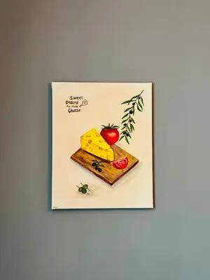 a picture of a piece of cheese and an apple on a cutting board at Stylish Home near Maastricht Alicias house in Lanaken