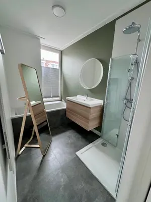 a bathroom with a sink and a mirror at Stylish Home near Maastricht Alicias house in Lanaken