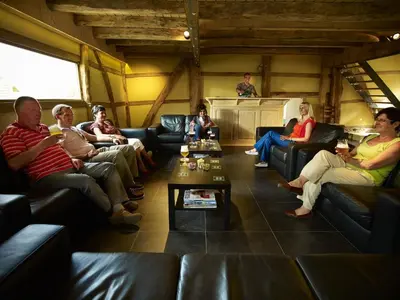 a group of people sitting in a room at Apartment 't Maanhof in Gingelom