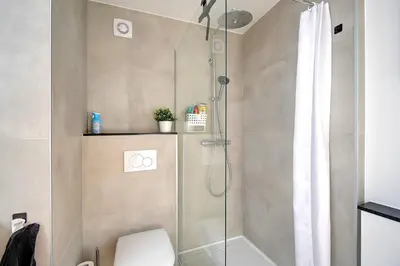 a bathroom with a shower with a toilet at LIÉGE - Le cocon de Chênée in Chênée