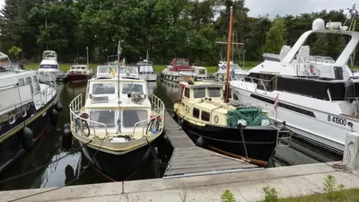 a group of boats docked in a harbor at B&B De Watering in Lommel