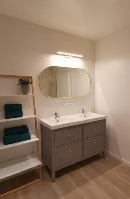 a bathroom with a sink and a mirror at Ten Velde - vakantiewoning 12 personen - sauna - bubbelbad in Hoeselt