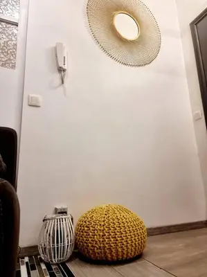 a room with a white door and a yellow ball on the floor at Appartement très proche médiacité - centre ville in Liège