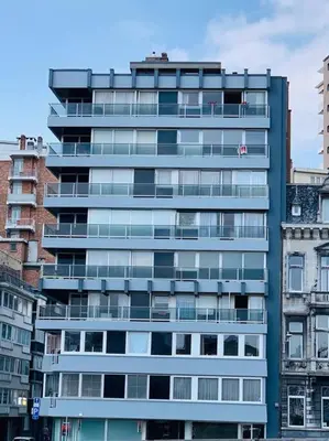 a tall building with many windows in a city at Appartement très proche médiacité - centre ville in Liège