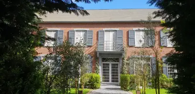 a red brick building with a large door at Sleep and Dream in Liège