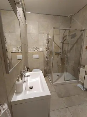 a bathroom with a sink and a shower at Sleep and Dream in Liège