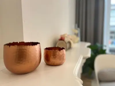 two wooden bowls sitting on a counter in a room at L'escapade chic - Cathédrale, Saint Lambert in Liège