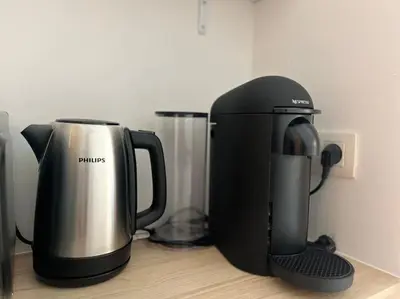 a coffee maker sitting on top of a counter at L'escapade chic - Cathédrale, Saint Lambert in Liège