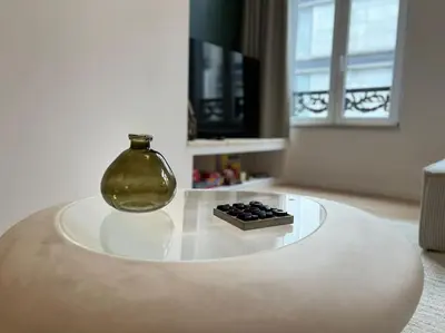 a glass vase sitting on top of a table at Duplex chic et spacieux - Hypercentre in Liège