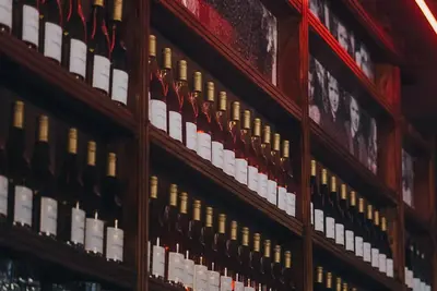 a display of wine bottles in a wine cellar at Hotel INGREDI in Bree