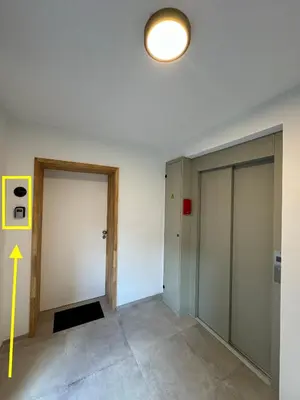 an empty room with two doors and a light at PentHouse 5.01 in Liège