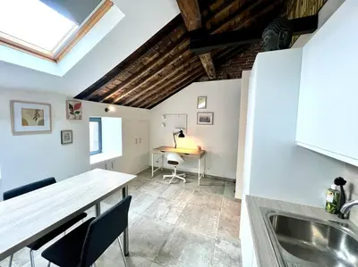 a kitchen with a sink and a desk in a room at Le Belvédère de la Rose-Hors château, hypercentre in Liège