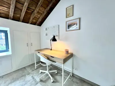 a home office with a desk and a chair at Le Belvédère de la Rose-Hors château, hypercentre in Liège