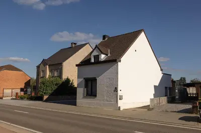a white house on the side of a street at Alivio - Thuiskomen bij jezelf op vakantie in Lummen
