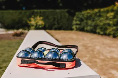 a tray of blue bowling balls sitting on a bench at Entre Nous in Herk-de-Stad