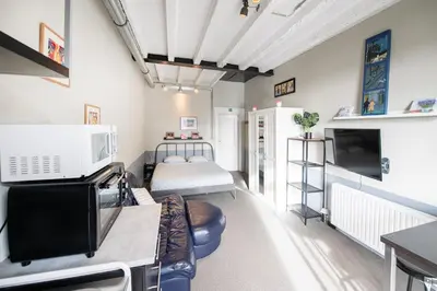 a small room with a bed and a tv at 