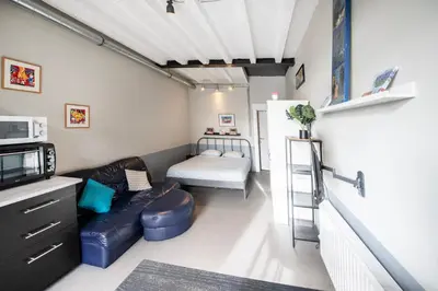 a living room with a couch and a bed at 