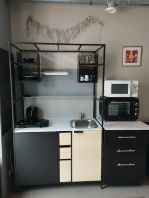 a small kitchen with a sink and a microwave at 