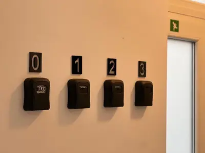 a wall with black numbers on a wall at Maison d’Ans in Ans