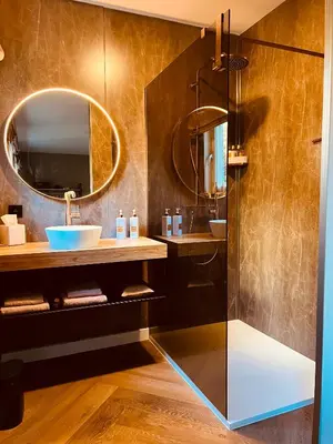 a bathroom with a sink and a mirror at Vakantievilla 't Boshuys in Lommel