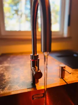 a close up of a kitchen sink with a tap at Vakantievilla 't Boshuys in Lommel