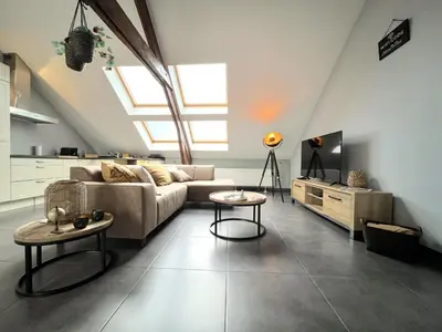 a living room with a couch and two tables at t Vennehuisje in Genk