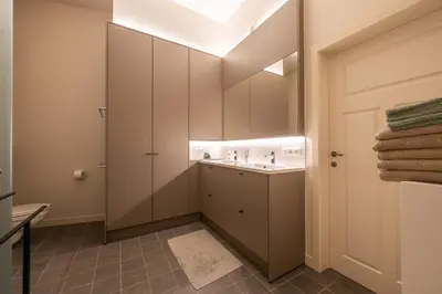 a bathroom with a sink and a mirror at De Droomhoeve in Bilzen