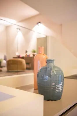 two glass vases sitting on a counter in a room at De Droomhoeve in Bilzen