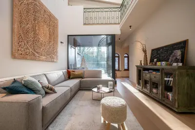 a living room with a couch and a table at De Droomhoeve in Bilzen