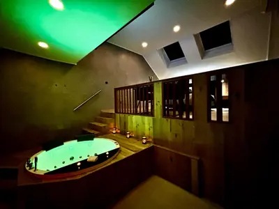 a large bathroom with a tub in the middle at Pause Thermale Suites Deluxe et Spa Privatif in Herstal