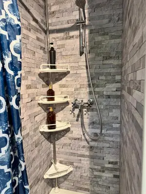 a bathroom with three sinks and a shower at Infinity met hottub op Jocomo Park in Lanaken