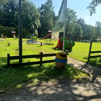 a park with a playground with at Infinity met hottub op Jocomo Park in Lanaken