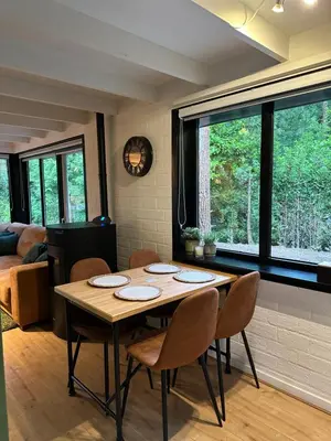 a dining room with a table and chairs at Vakantiehuis Lanaken in Lanaken