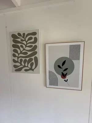 two pictures hanging on a white wall at Vakantiehuis Lanaken in Lanaken