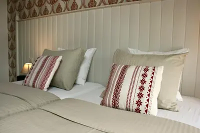 a bedroom with two beds with pillows at B&B Horpala in Heers