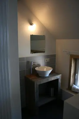 a bathroom with a sink and a mirror at B&B Horpala in Heers