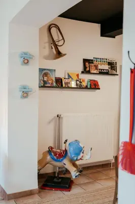 a room with a toy horse sitting on a floor at La Courte Échelle in Verviers