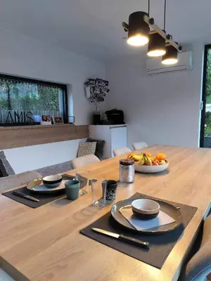 a wooden table with a plate of fruit on it at GP - F1 FRANCORCHAMPS - 2 Chambres in Trooz
