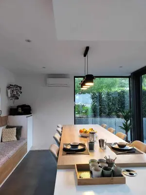 a living room with a table and a dining room at GP - F1 FRANCORCHAMPS - 2 Chambres in Trooz
