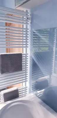 a bedroom with a window with a bed and a towel at Just for sleep in Liège