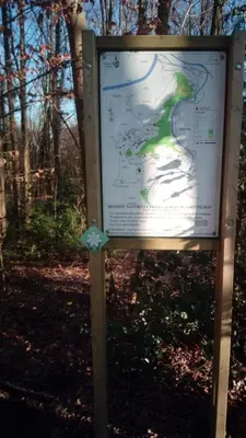 a sign in the woods with a map at Just for sleep in Liège