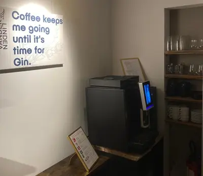 a room with a computer sitting on top of a refrigerator at DeStoker in Hasselt