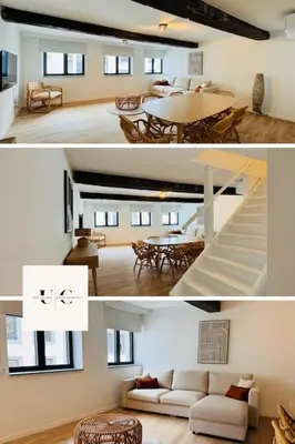 a living room with a couch and a table at Urbanchic Appartement Evasion 3D in Liège