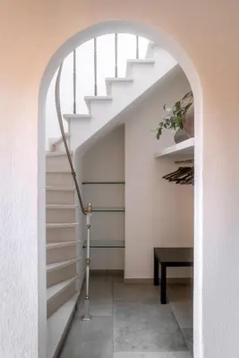 an archway leading up to a staircase in a house at Puur17 in Lommel