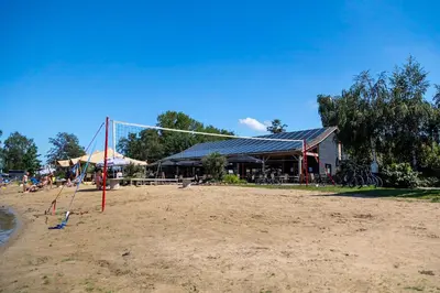 a volley ball net in front of a building at Vakantiehuis 25 min Roermond Maasmechelen Maastricht in Kinrooi
