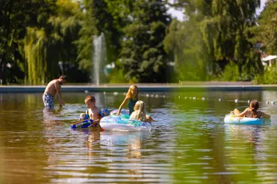 a group of people floating on tubes in the water at Vakantiehuis 25 min Roermond Maasmechelen Maastricht in Kinrooi