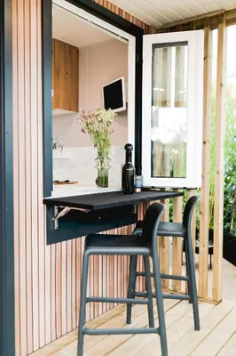 a desk with a chair in front of a mirror at Vakantiehuis 25 min Roermond Maasmechelen Maastricht in Kinrooi