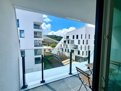 a balcony with a view of a building at Le studio des Guillemins - Boverie, Gare in Liège